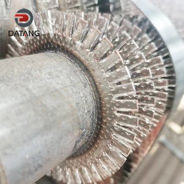 Serrated fin tubes for thermal power plant boiler heat exchangers