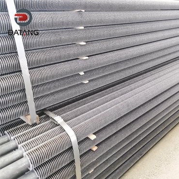 Serrated finned tubes for nuclear power plant heat exchangers