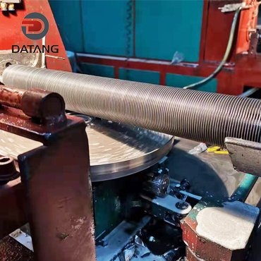 Wrap around fin tube for heat exchangers in power plants